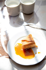 school breakfast - cottage cheese casserole with apple jam on the table