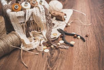 Sewing concept. Thread spools, buttons and sewing needles.