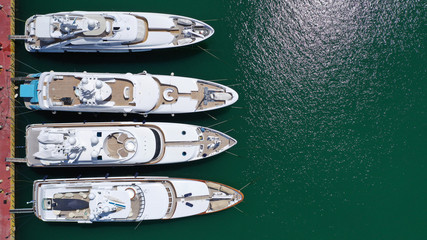 Aerial drone top view photo of luxury yachts docked in mediterranean destination port