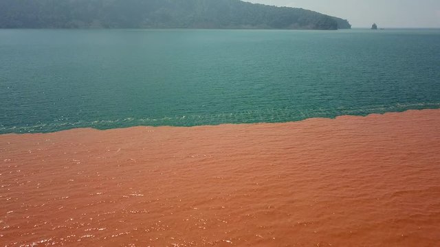 Undersea Volcanic Activity At Anak Krakatau Turns Ocean Orange