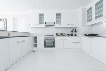 Fototapeta na wymiar Beautiful Modern Kitchen In New Luxury Home
