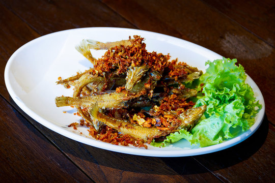 seafood - golden brown deep fried fish with tamaric - halal food