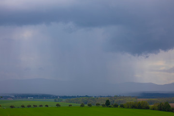 dramatic stormy sky with rain showers