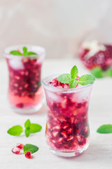 Pomegranate green tea cocktail. Selective focus, space for text.