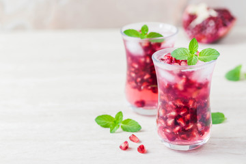 Pomegranate green tea cocktail. Selective focus, space for text.