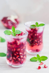 Pomegranate green tea cocktail. Selective focus, space for text.