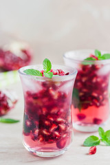 Pomegranate green tea mojito . Selective focus, space for text.