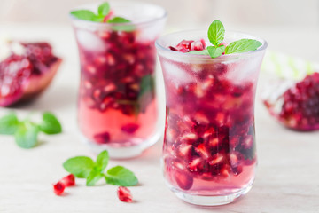 Pomegranate green tea mojito . Selective focus, space for text.