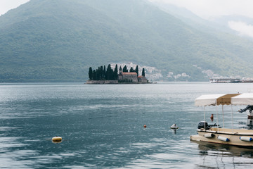 Beautiful view of the Bay of Kotor in Montenegro near the city of Perast. In the sea an island with a church.
