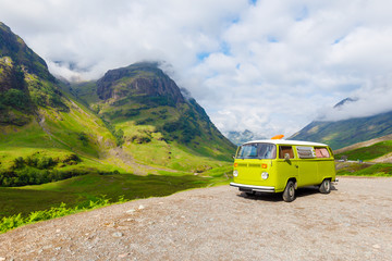 green Camper Van at three sister near glencoe in Scotland - obrazy, fototapety, plakaty