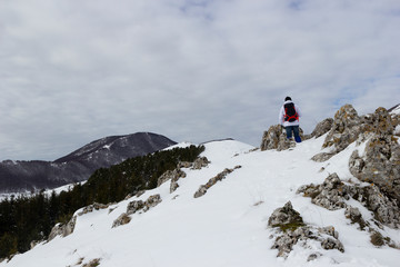 hiker on mountain and snow