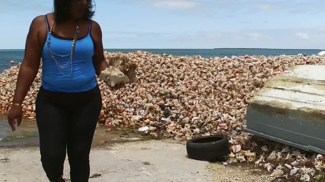 The Original Bahama Mama Holding Conch Shell, Conch Shell Palace,  West End Grand Bahama, Bahamas