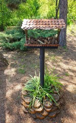 Feeder for birds in the park.