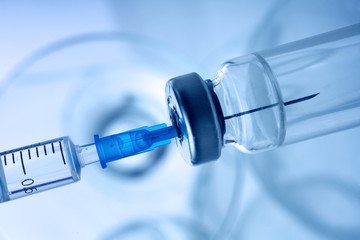 Vaccine vial dose flu shot drug needle syringe,medical concept vaccination hypodermic injection