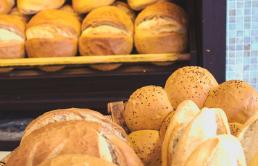Fresh loaf of white bread. White bread on the showcase in the bakery. Hot baking. Bakery products...