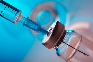 Vaccine vial dose flu shot drug needle syringe,medical concept vaccination hypodermic injection