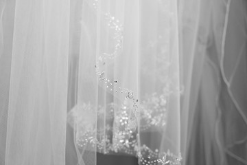 Wedding dress beading detail close up.