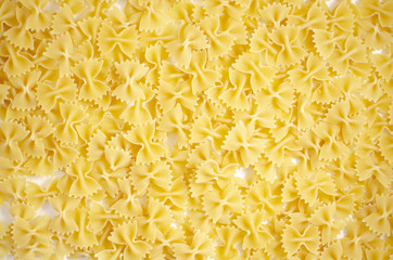 Italian uncooked pasta. Raw farfalle. Healthy food. Italian dishes.