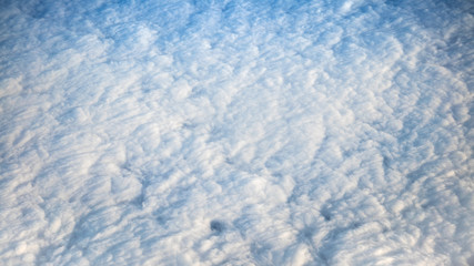 Wonderful view of cloudscape with clear blue sky from above.