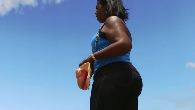 The Original Bahama Mama Holding Conch Shell, Conch Shell Palace,  West End Grand Bahama, Bahamas