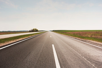 Beautiful road. Background. Road and field
