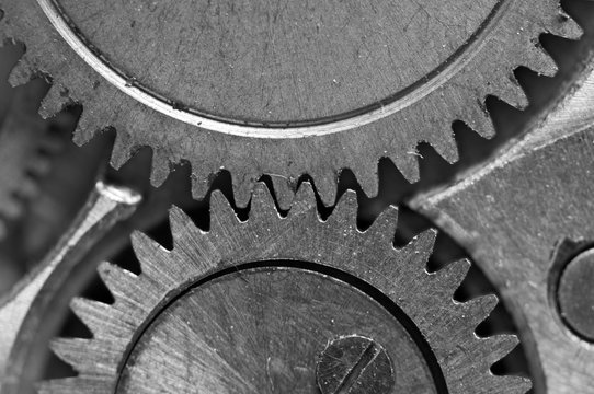 Concept Teamwork or successful business design. Black and white photo background  of old metal gears or parts. Macro