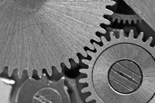 Concept Teamwork or successful business design. Black and white photo background  of old metal gears or parts. Macro