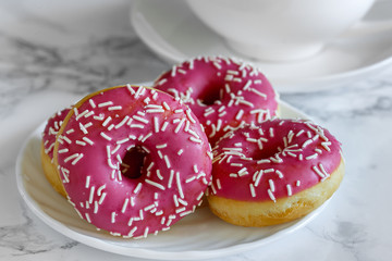 Donaltsa donuts with pink icing