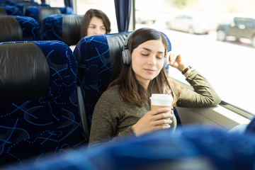 Relaxing Moments With Coffee And Music In Bus Ride