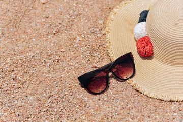 Straw hat and sun glasses on a paradise tropical beach with turquoise sea, Kuredu, Maldives