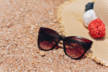 Straw hat and sun glasses on a paradise tropical beach with turquoise sea, Kuredu, Maldives