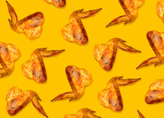 Colorful pattern of chicken wings roasted on bbq. Yellow background. Beautiful background for packaging design