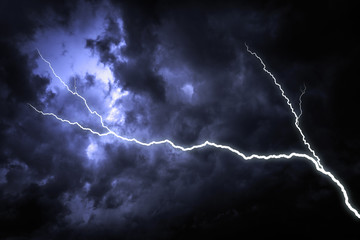 Lightning with dramatic clouds. Lightning strike on the dark cloudy sky.