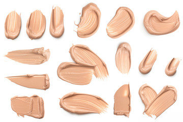 Light beige makeup smear of creamy foundation isolated on white background