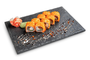 Set of rolls with wasabi and pickled ginger on stone serving board