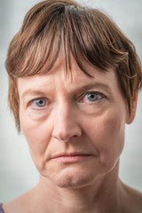 Fototapeta premium Paris, France - 05 19 2019: Studio photo session with my girlfriend. Woman with bad expressive face