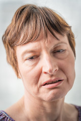 Naklejka premium Paris, France - 05 19 2019: Studio photo session with my girlfriend. Woman with bad expressive face