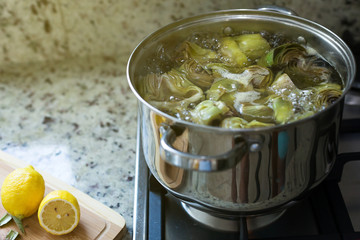 Cleaned artichokes cooking