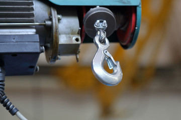 Massive industrial hook for lifting and moving parts in the repair shop