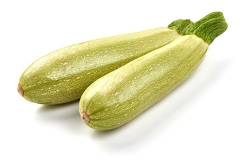 Fresh green zucchini, close-up, isolated on white background