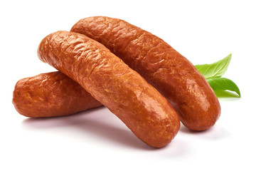 Smoked pork sausages with basil leaves, dry meat, close-up, isolated on white background