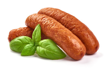 German traditional smoked sausages with basil leaves, dry meat, close-up, isolated on white background