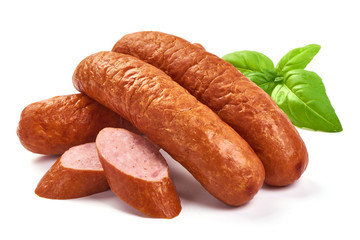 Bavarian Smoked Sausages with basil leaves, dry meat, close-up, isolated on white background