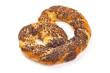 Appetizing Bavarian pretzel with poppy seeds, close-up, isolated on white background