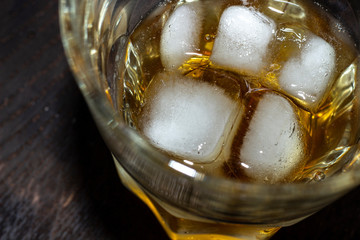 Whiskey in glass with ice