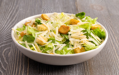 Fresh Caesar Salad on a Wooden Table