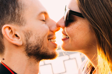 guy and girl want to kiss. bearded guy and girl with freckles in
