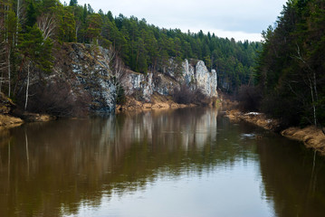 Fototapeta na wymiar rocky shore of the river in early spring