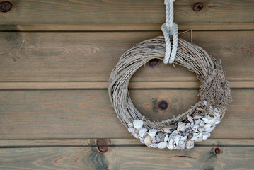 Wooden wall decoration with Sea thematic frame, decorated with seashells. Marine themes in hand...
