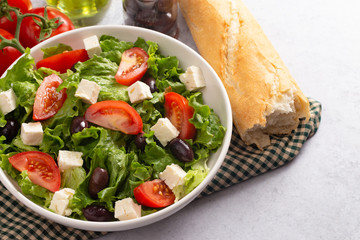 Greek Salad with Olives Tomatos and Feta Cheese on a Concrete Countertop